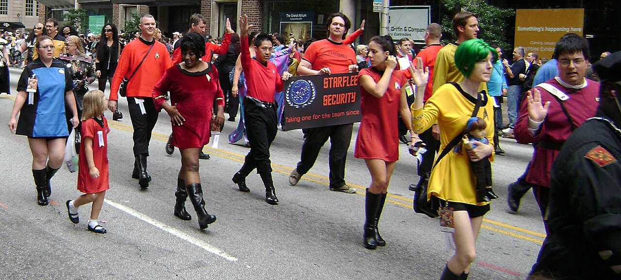 Families in colorful Star Trek costumes at the 2009 Dragon Con parade